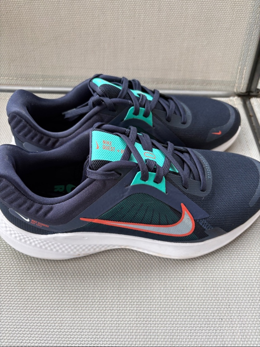Nike Stylish Navy and Teal Women’s Running Sneakers with Orange Swoosh